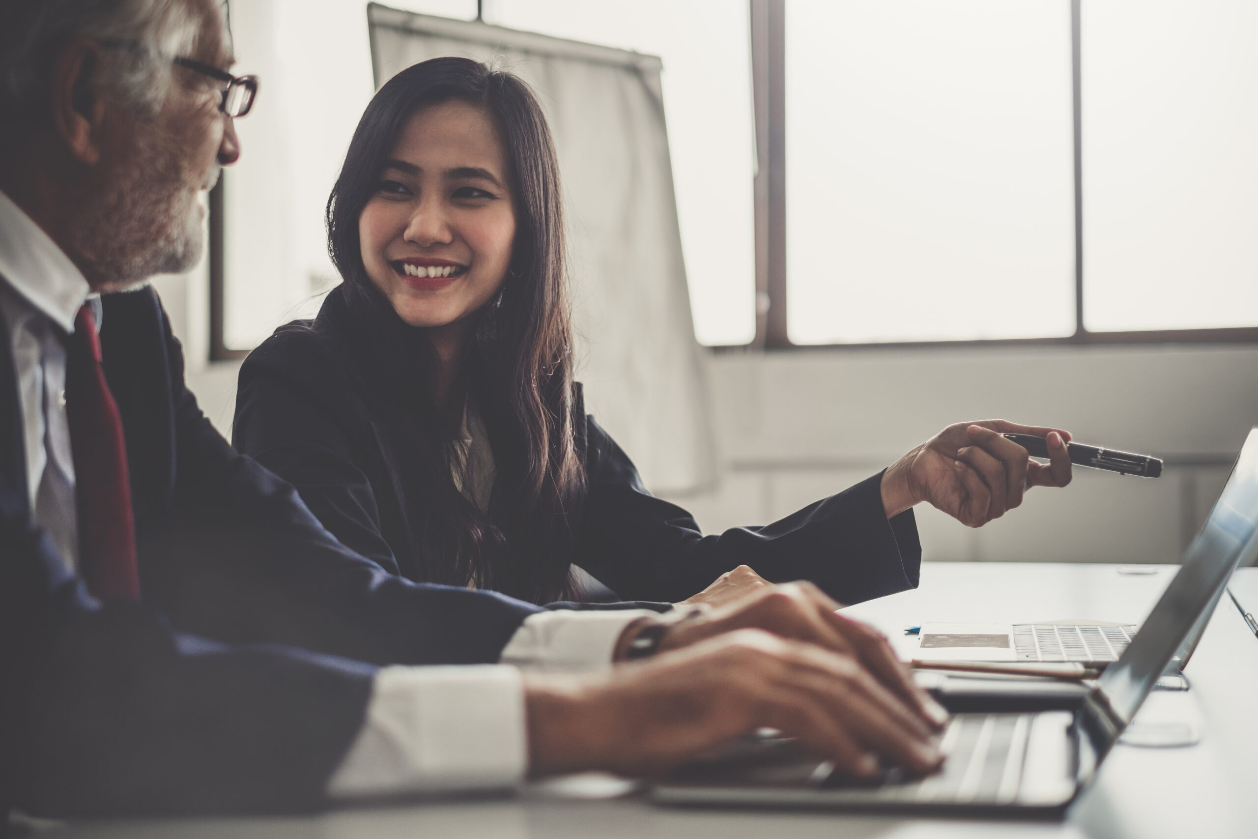 Business people discussing while meeting in office, working with Business people discussing while meeting in office, working with laptop